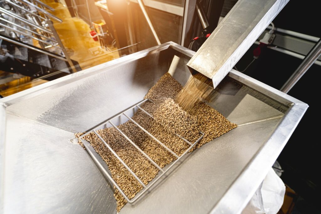 Grain going into a hopper.